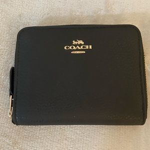 NWOT Coach wallet, never been used. Black
